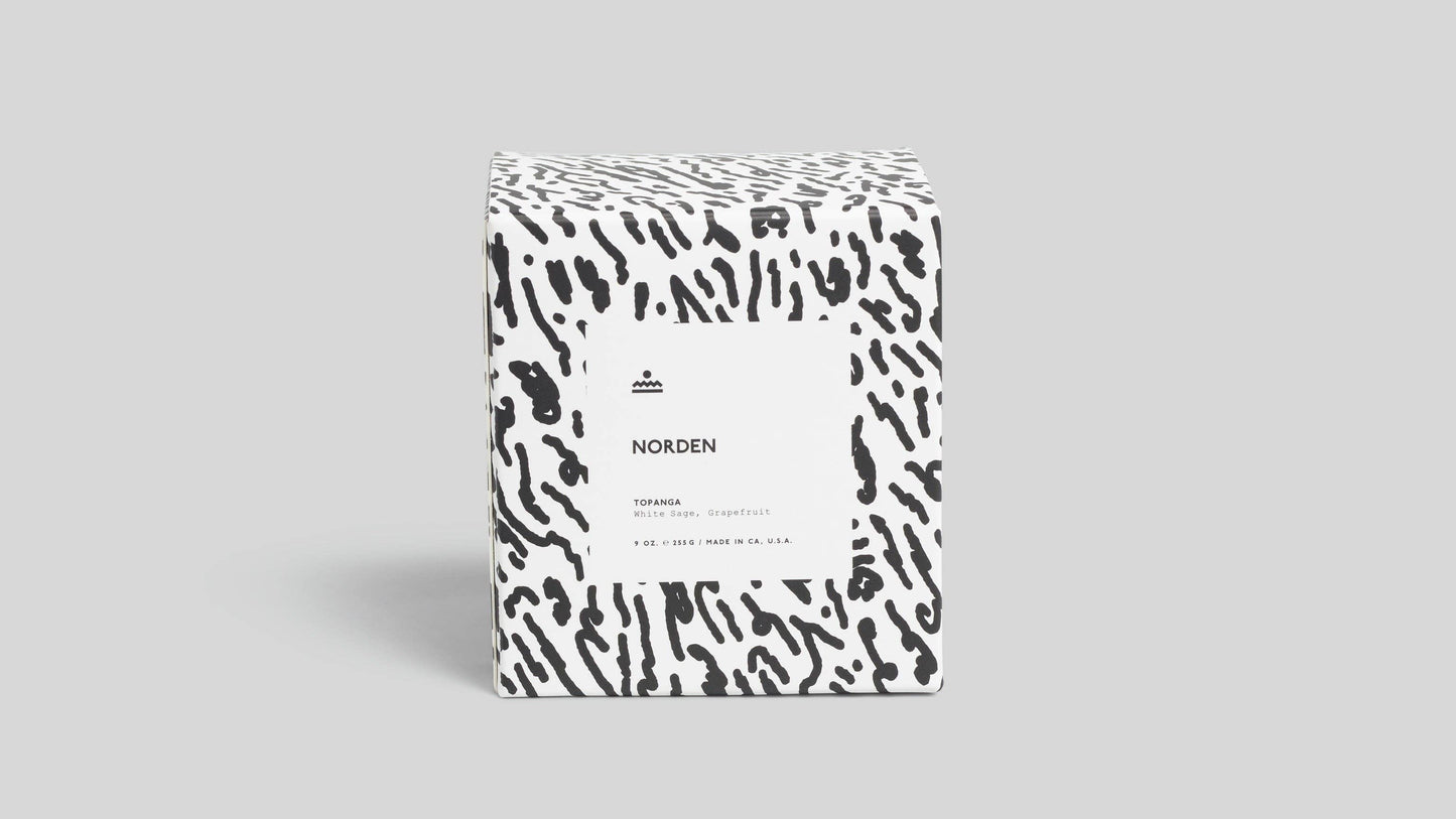 Product packaging with a black and white pattern on a gray background