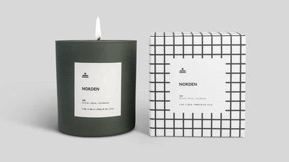 Candle and its packaging with 'Norden' branding on a light gray background